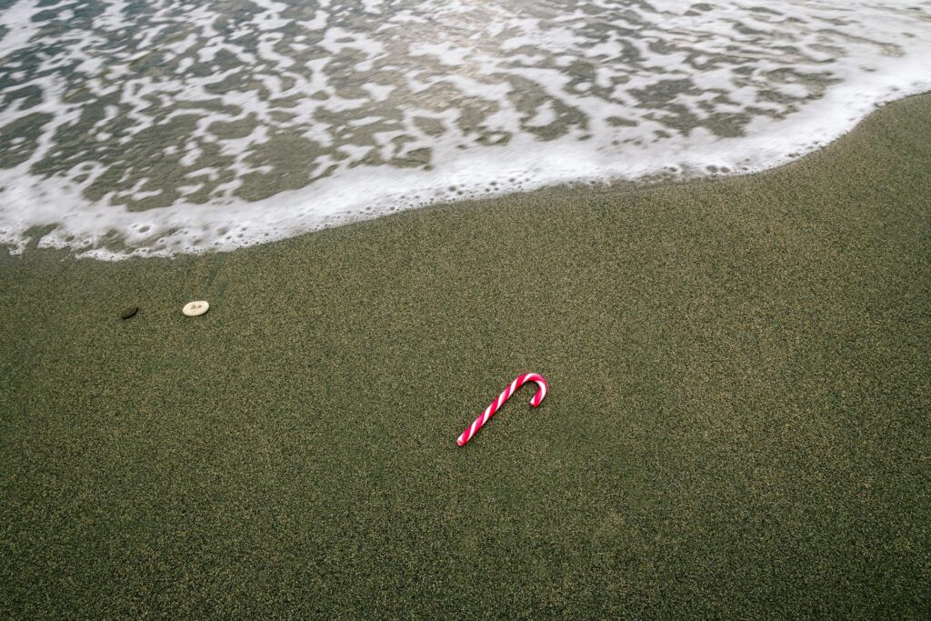 A candy cane on the beach